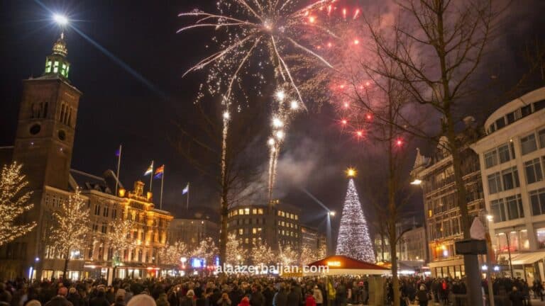 ألعاب نارية تضيء سماء أمستردام فوق القنوات ونهر الآمستل خلال احتفالات رأس السنة في هولندا، مع حشود العدّ التنازلي في ساحة دام وأجواء شتوية مضيئة